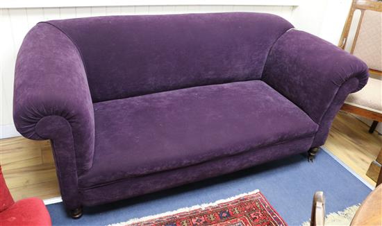 A late Victorian drop-arm Chesterfield settee upholstered in purple fabric W.190cm